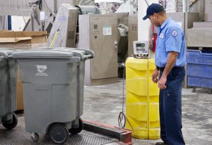 Royal Document Destruction Worker with bin