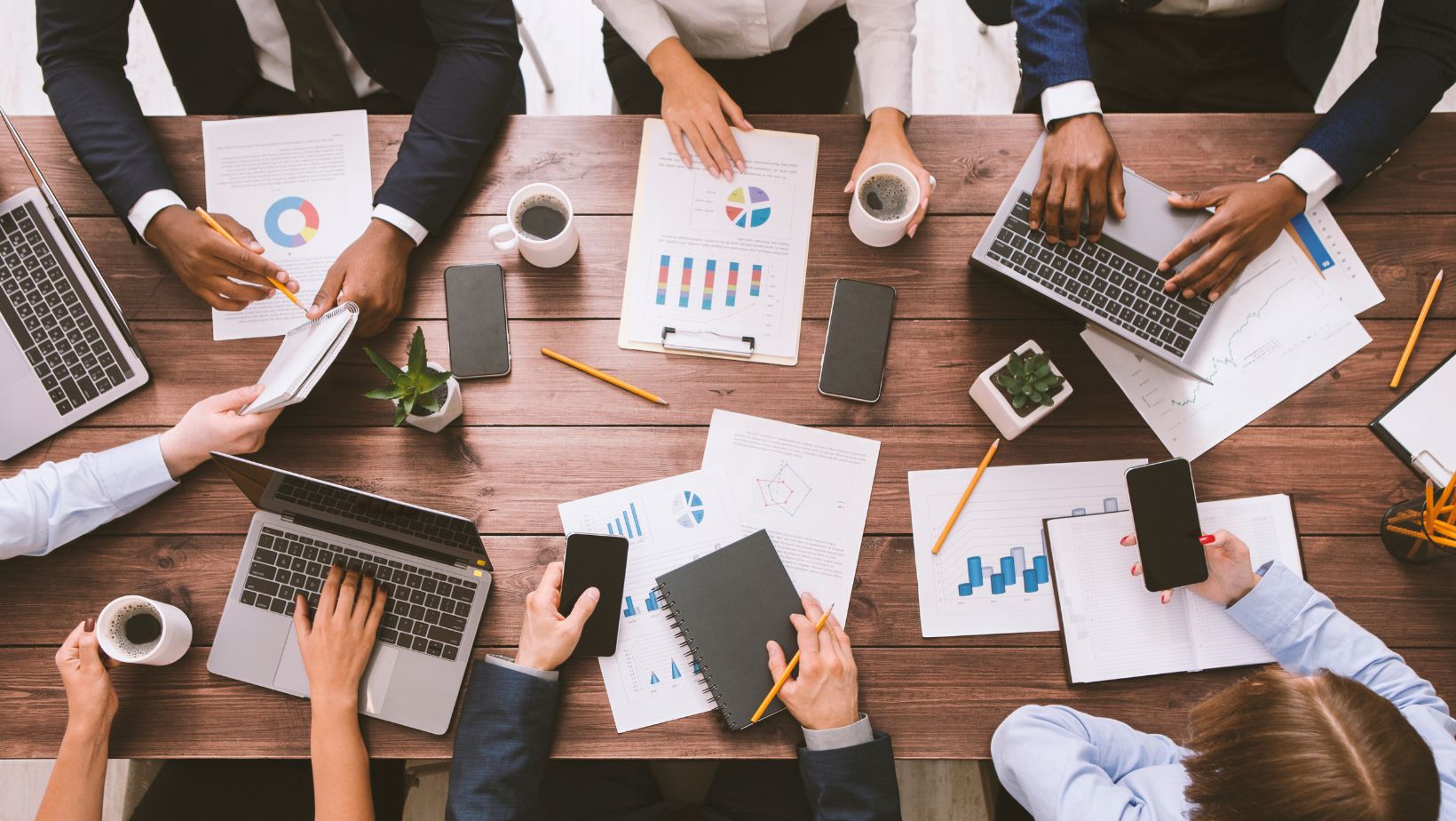 Cincinnati business employees working on a project at a table